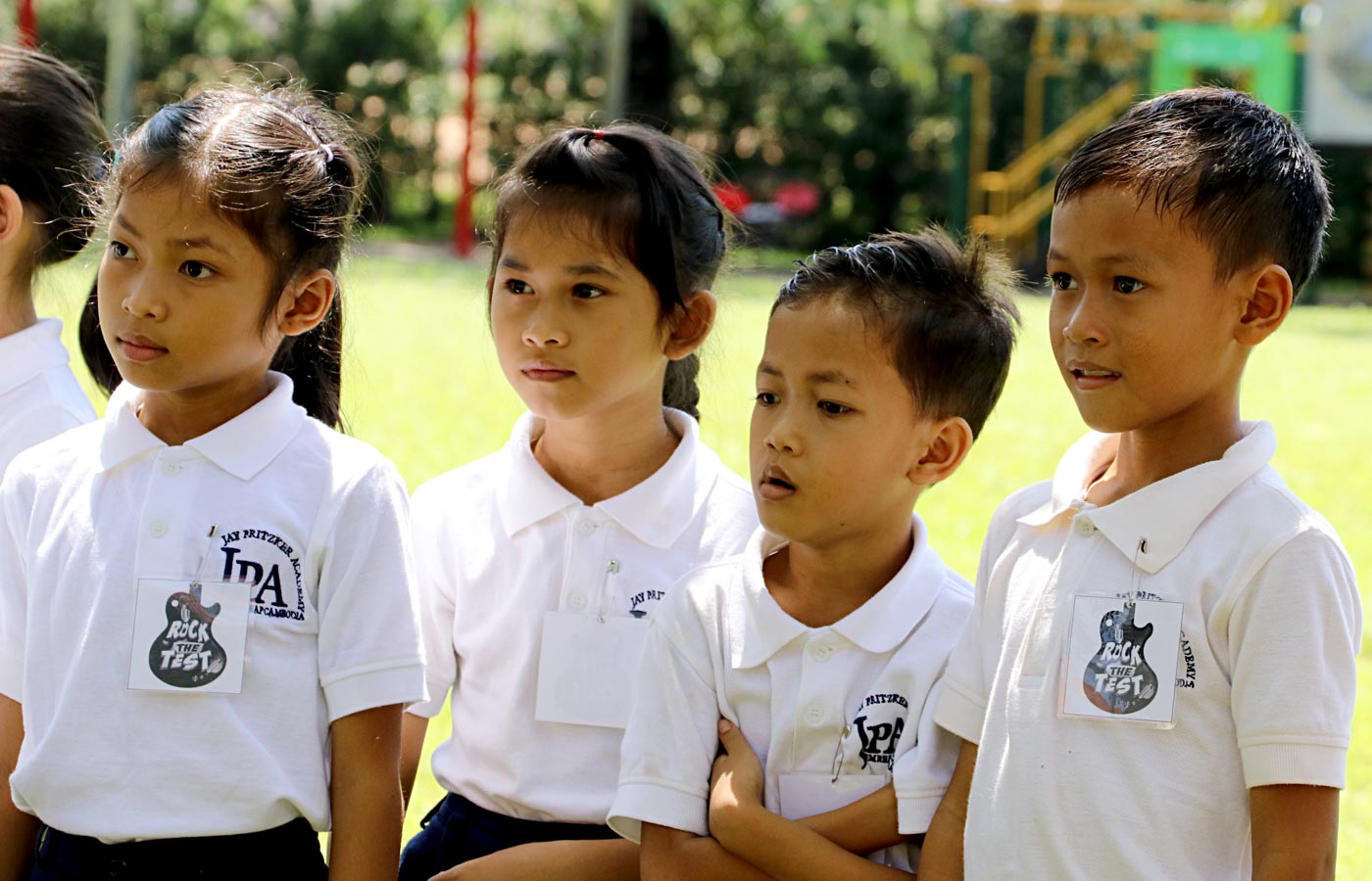 Jay Pritzker Academy students on the field during Rock the Test at JPA campus, Siem Reap, Cambodia. Jay-Pritzker-Academy-Siem-Reap-Cambodia.